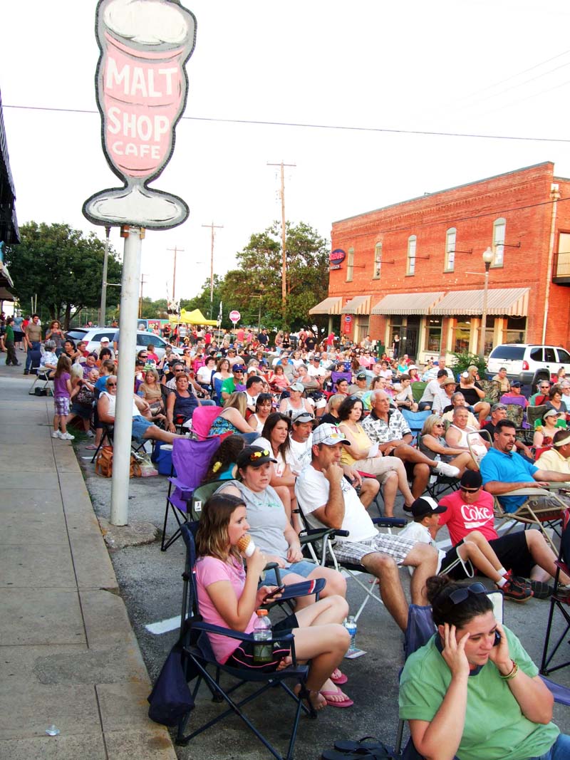 photo of crowd listening to band perform